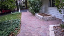 Reclaimed Purrington paver sidewalk and Fond Du Lac planter